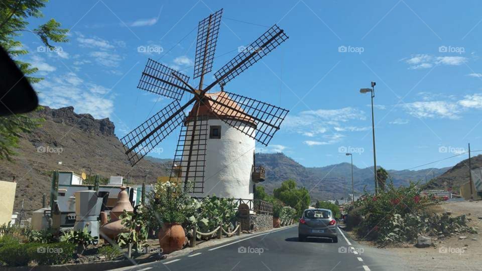 beautiful windmill on a mountainous road in gran canaria