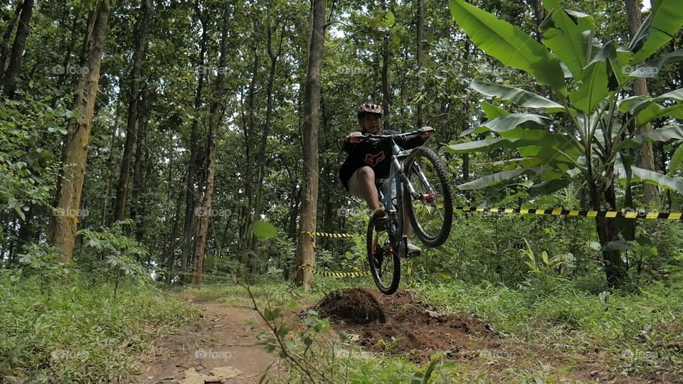 Bike challenge jump over obstacles