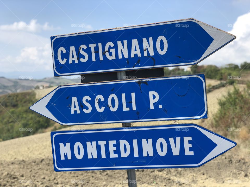 Road signs to Castignano, Ascoli Piceno and Montedinove, Marche region, Italy