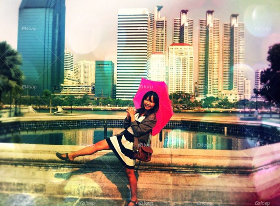 Pink Umbrella fun . Fun with hot temperatures in Bangkok, Thailand.