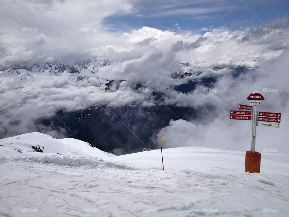 Snow clouds mountains rocks