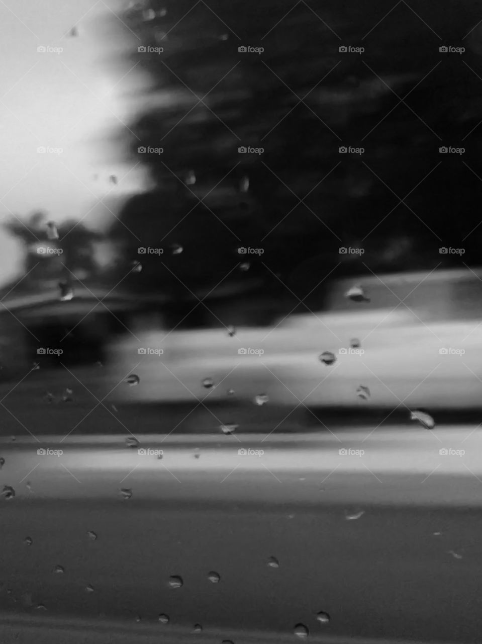 Black and white with raindrops on the window