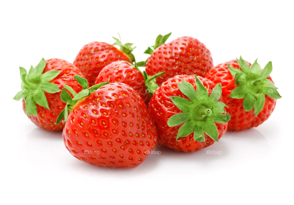 The garden strawberry (or simply strawberry; Fragaria × ananassa)[1] is a widely grown hybrid species of the genus Fragaria, collectively known as the strawberries. It is cultivated worldwide for its fruit. The fruit is widely appreciated for its characteristic aroma, bright red color, juicy texture, and sweetness. It is consumed in large quantities, either fresh or in such prepared foods as preserves, juice, pies, ice creams, milkshakes, and chocolates. Artificial strawberry flavorings and aromas are also widely used in many products like lip gloss, candy, hand sanitizers, perfume, and many others.