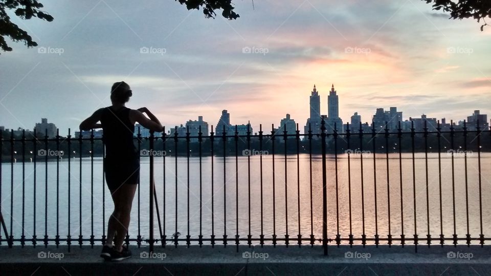 Girl Looking Over Water Backlit NYC