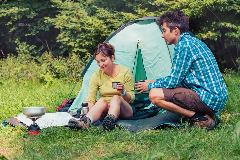 Spending a vacation on camping. Preparing a meal outdoor. Planning next trip