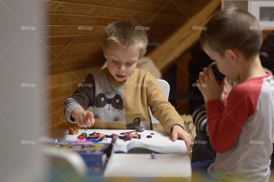 boys playing with lego