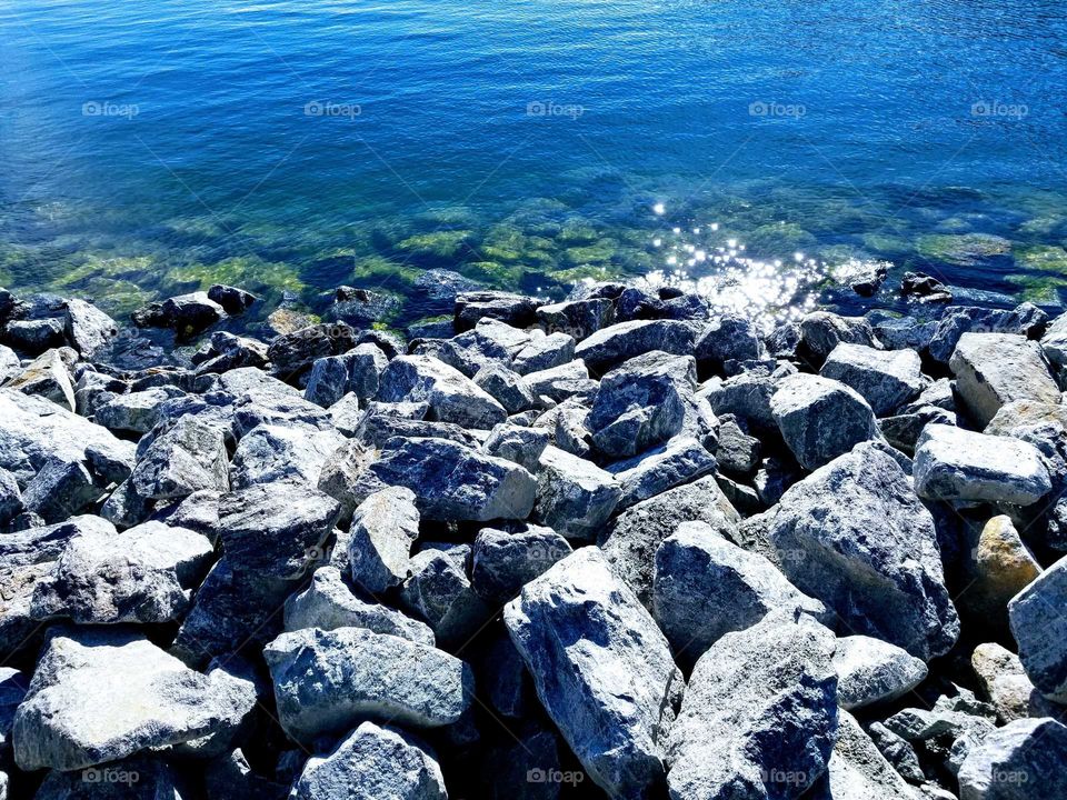 glimmering water next to rocks in the Baltic sea.