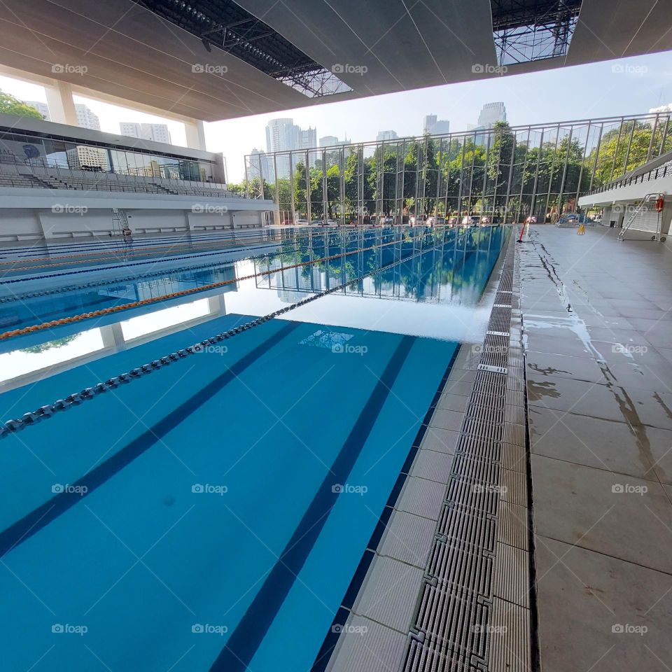 the pool area has been prepared for the swimming competition. The swimming track has been installed in the pool and the championship is ready to start