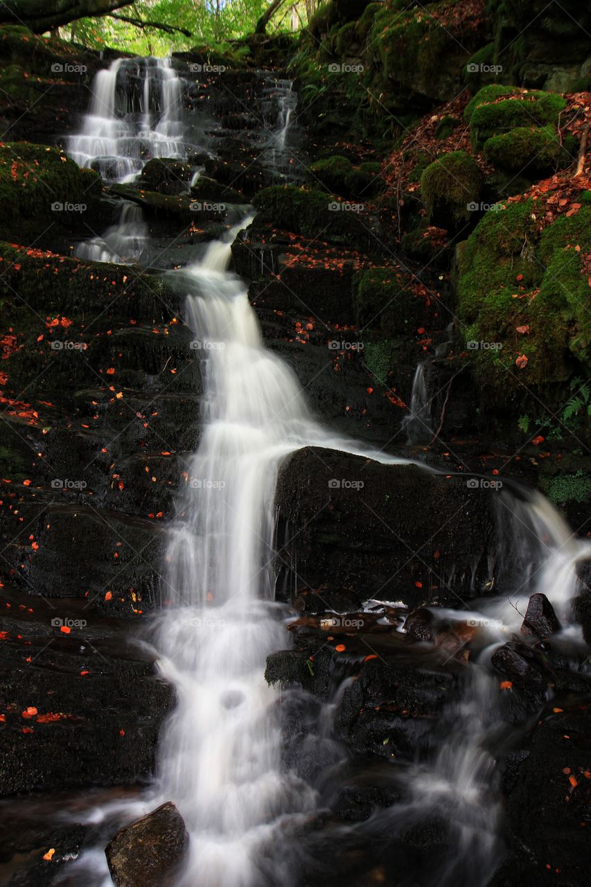 Small cascading waterfall in the autumn