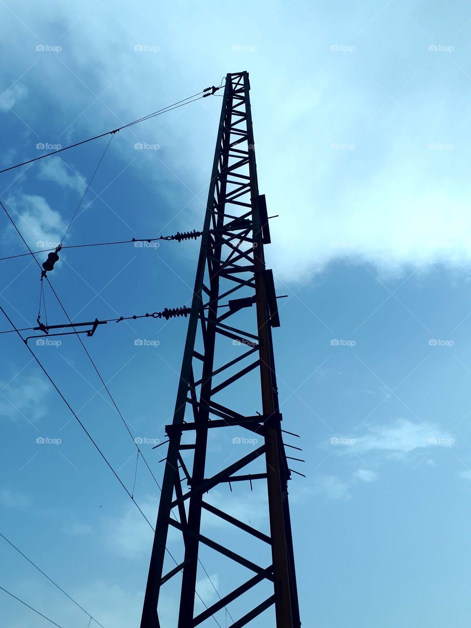 railway columns that hold contact lines above the track