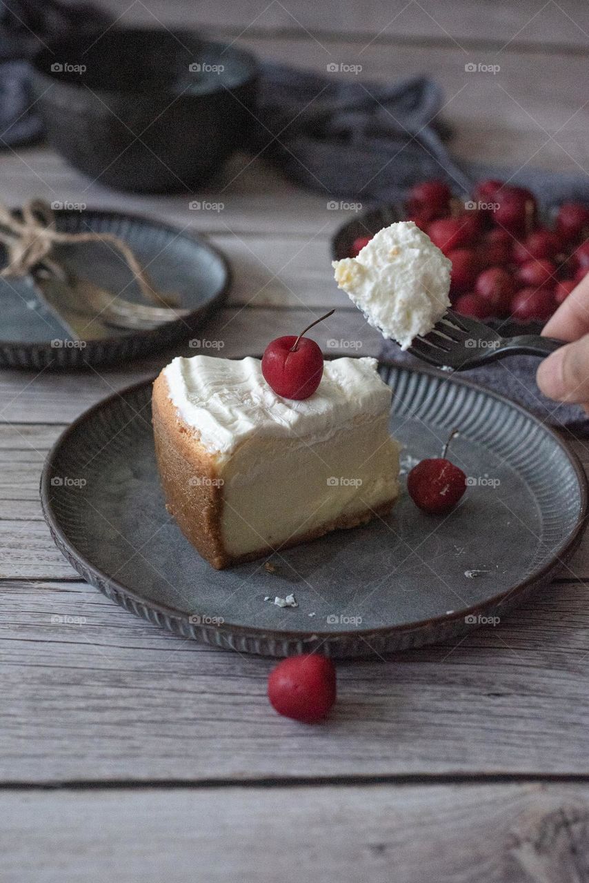 Cheesecake with cherry.