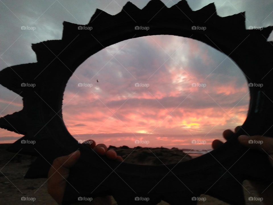 beautiful sunset trough circle.