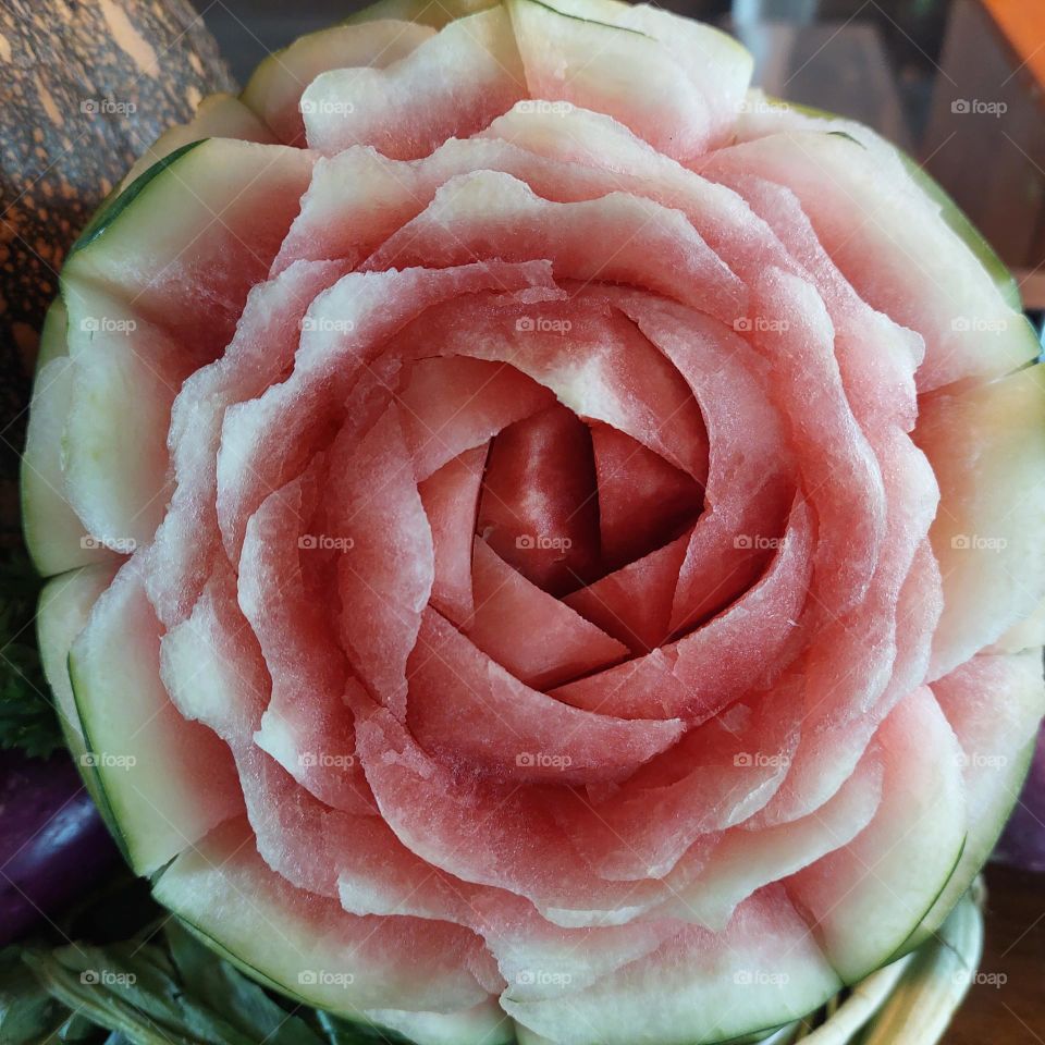 watermelon carved in the shape of a rose