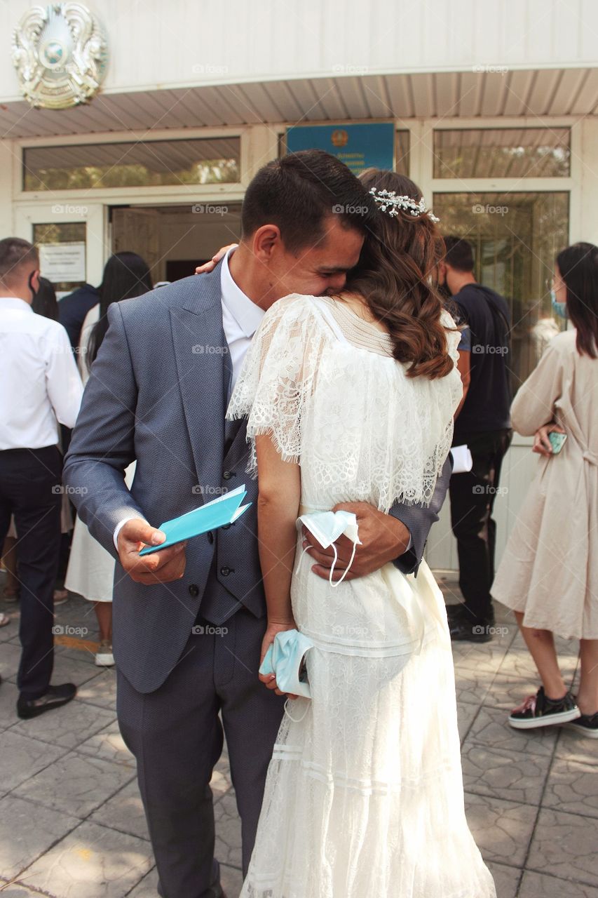 Newlyweds have just received a marriage certificate