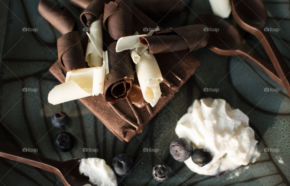 White and dark chocolate piled on a crisp chocolate
