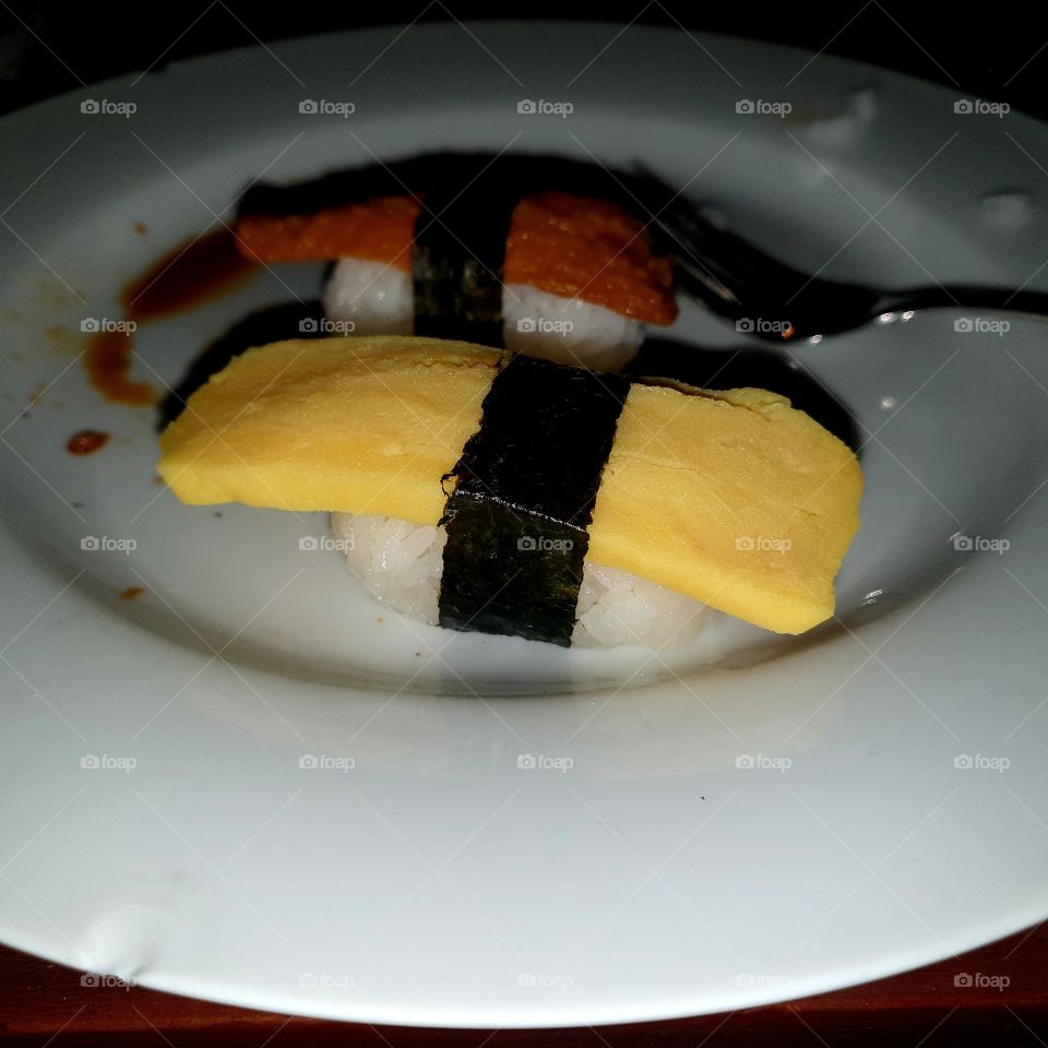 sushi delicious with egg and rice