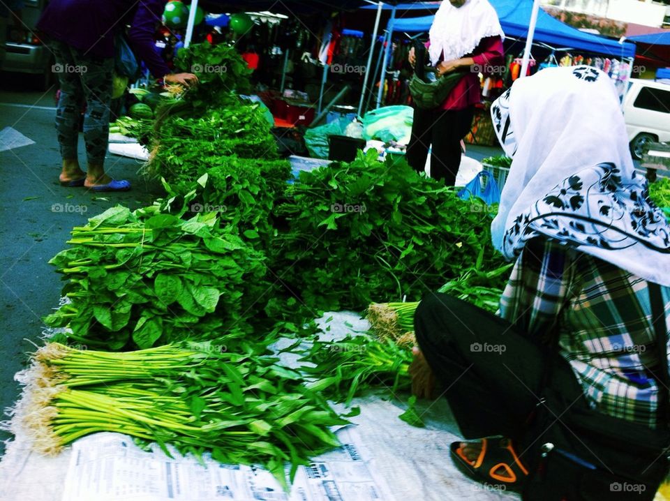 Woman selling vegetables