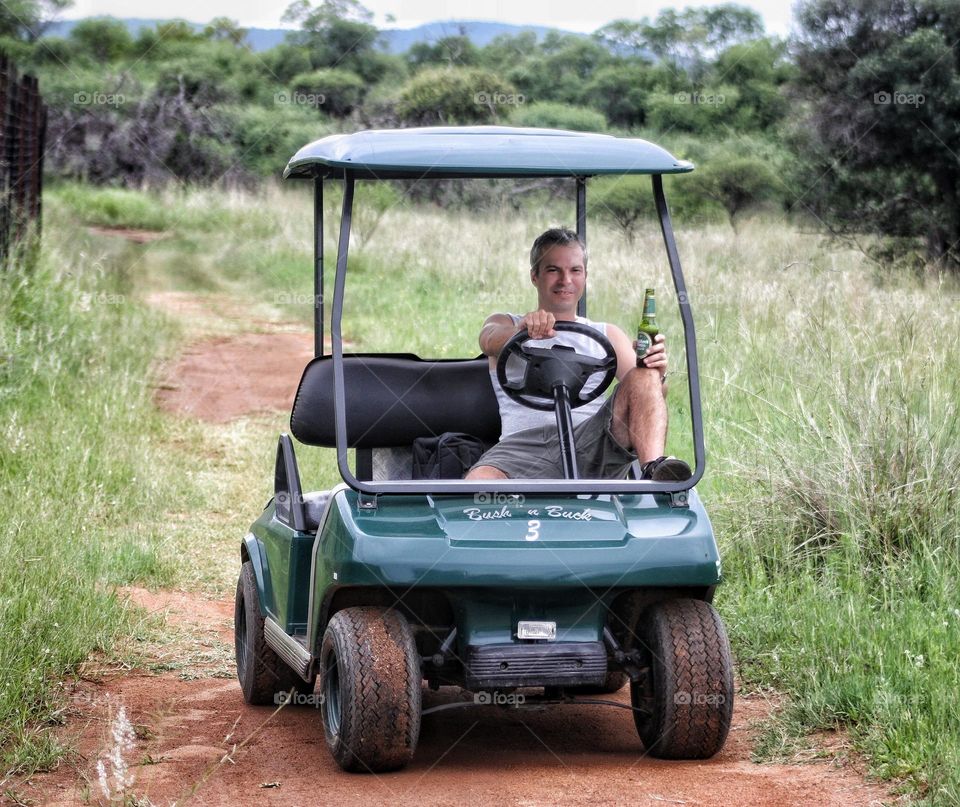 happiness,Game viewing in a golf cart  and a beer.