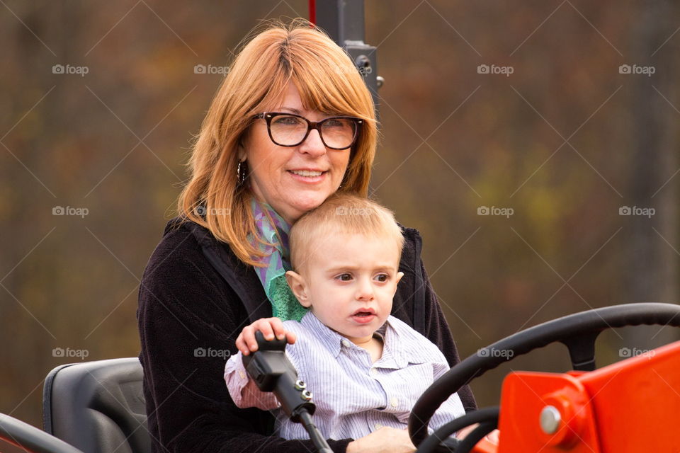 Mother and Son Tractor Driving