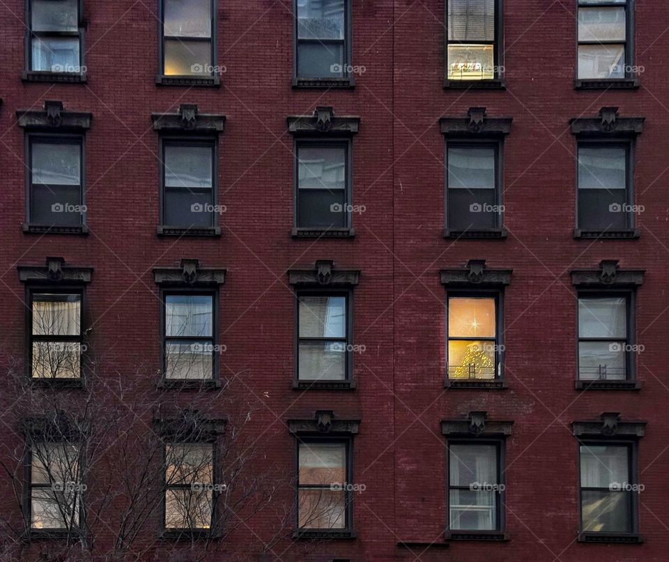 Christmas decorations in a tenement window 