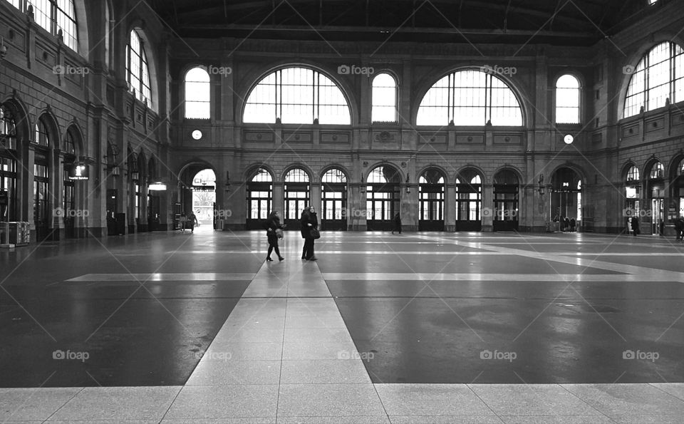 Passengers walk through the elegant train station in Zurich, Switzerland.