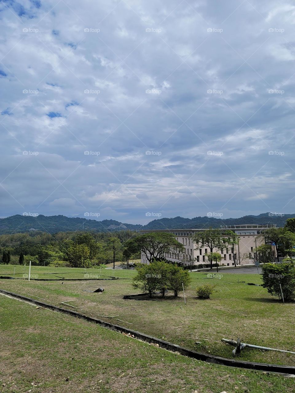 Architecture and landscape, blue sky and white clouds, grass and trees