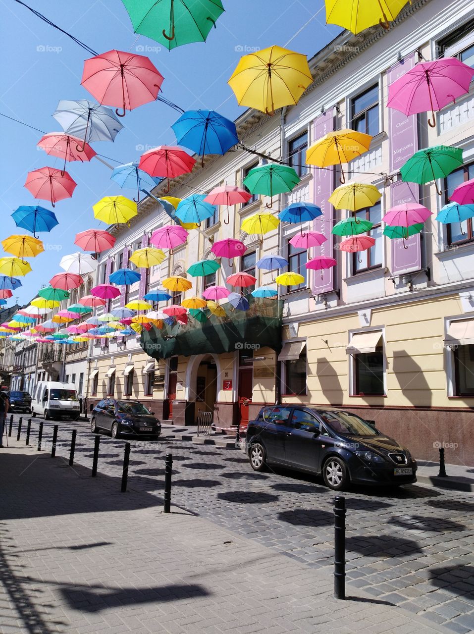a sunny day colourful umbrellas