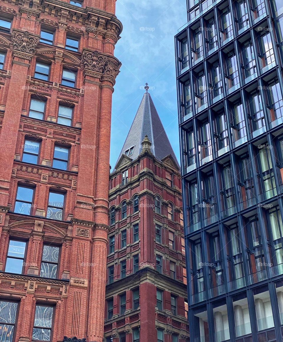 Newer and older buildings crowded together in lower Manhattan 