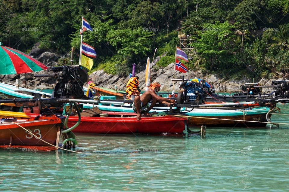 Man work on boat