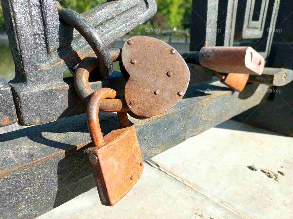 metal padlocks hung on the bridge.