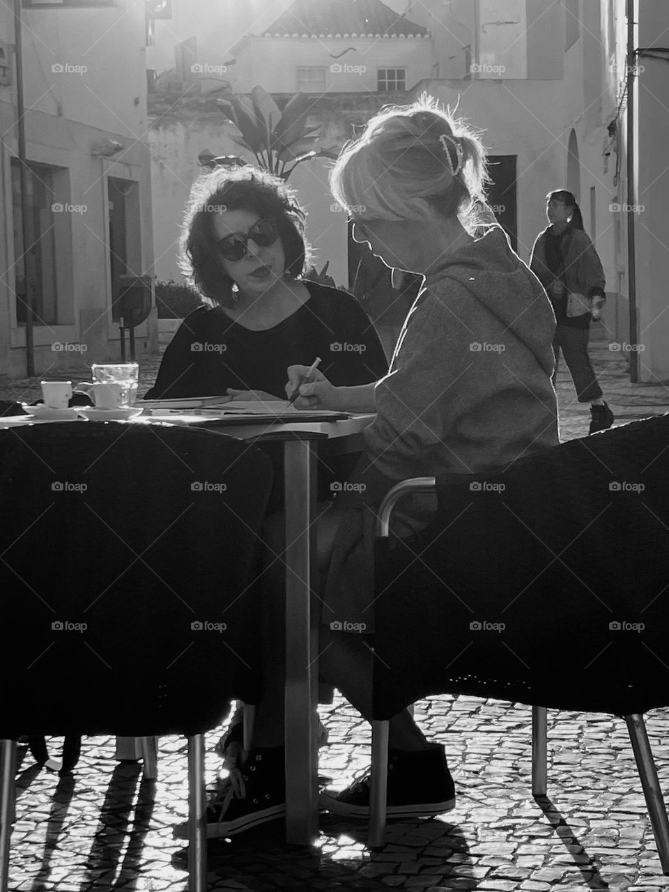 Two friends in sunny city