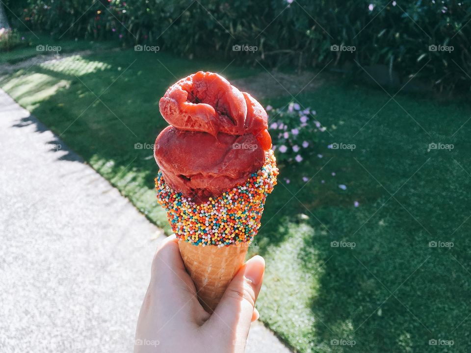 Hand holding ice cream cone