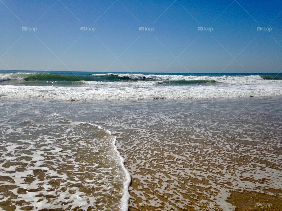 The ocean tide coming in at a California beach