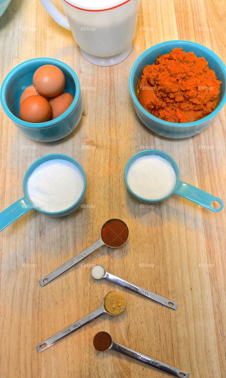 Flat lay of ingredients for making pumpkin pies