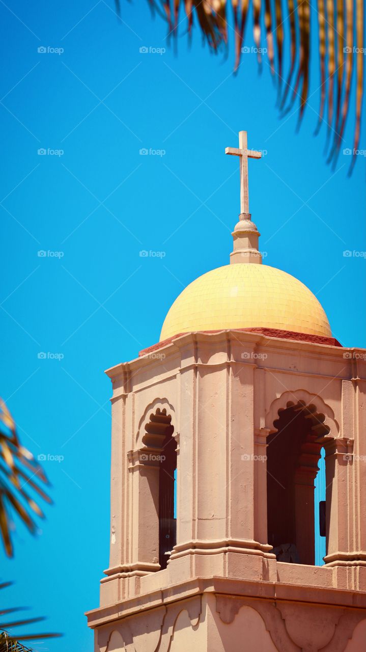 The bright yellow dome Sacred Heart Church in Ocean Beach, California illuminated in the sun of a beautiful spring day