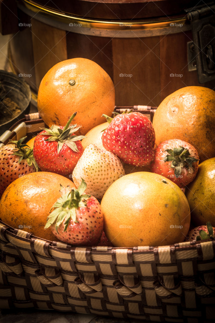 Fruit in basket. orenge and strawberry in the basket 