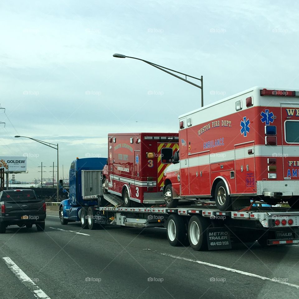 Fire department ambulances on a flatbed wrecker, both broken down🚨🚑