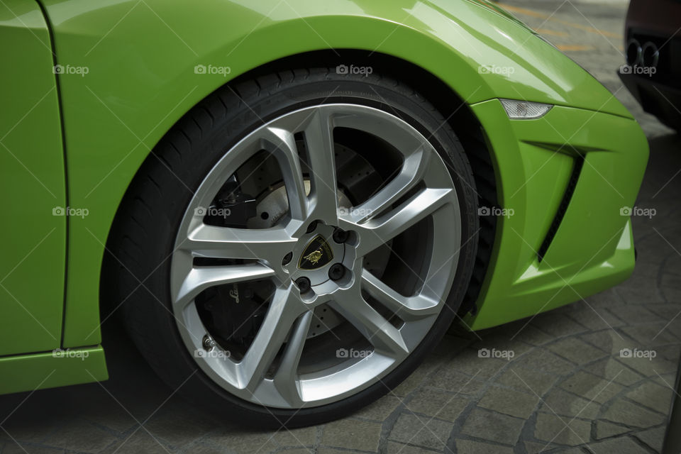 front wheel close up of green Lamborghini Gallardo squadra corse special edition coupe