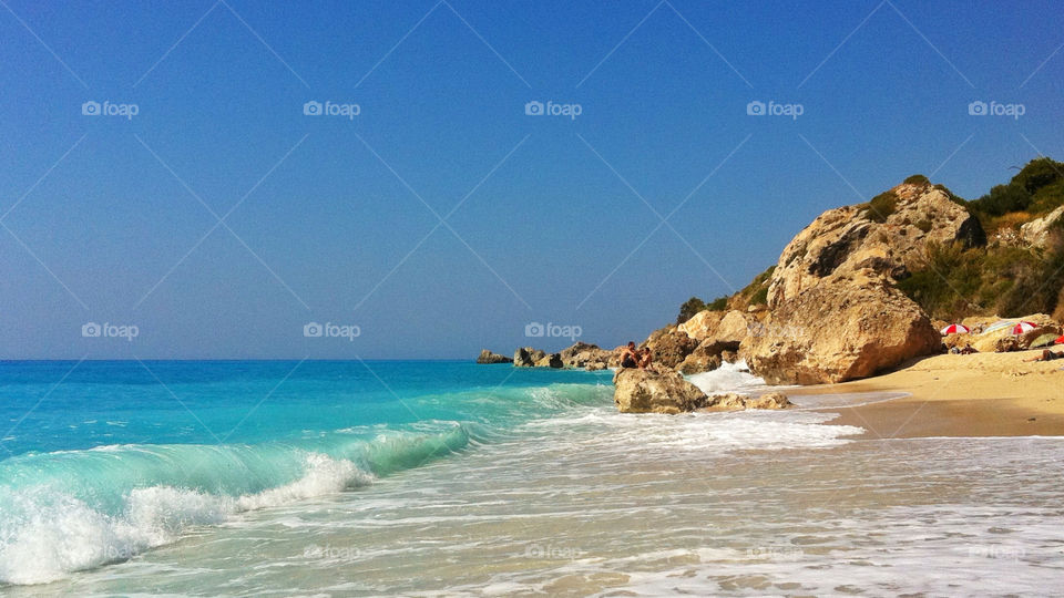 lefkada beach summer rocks by chattis