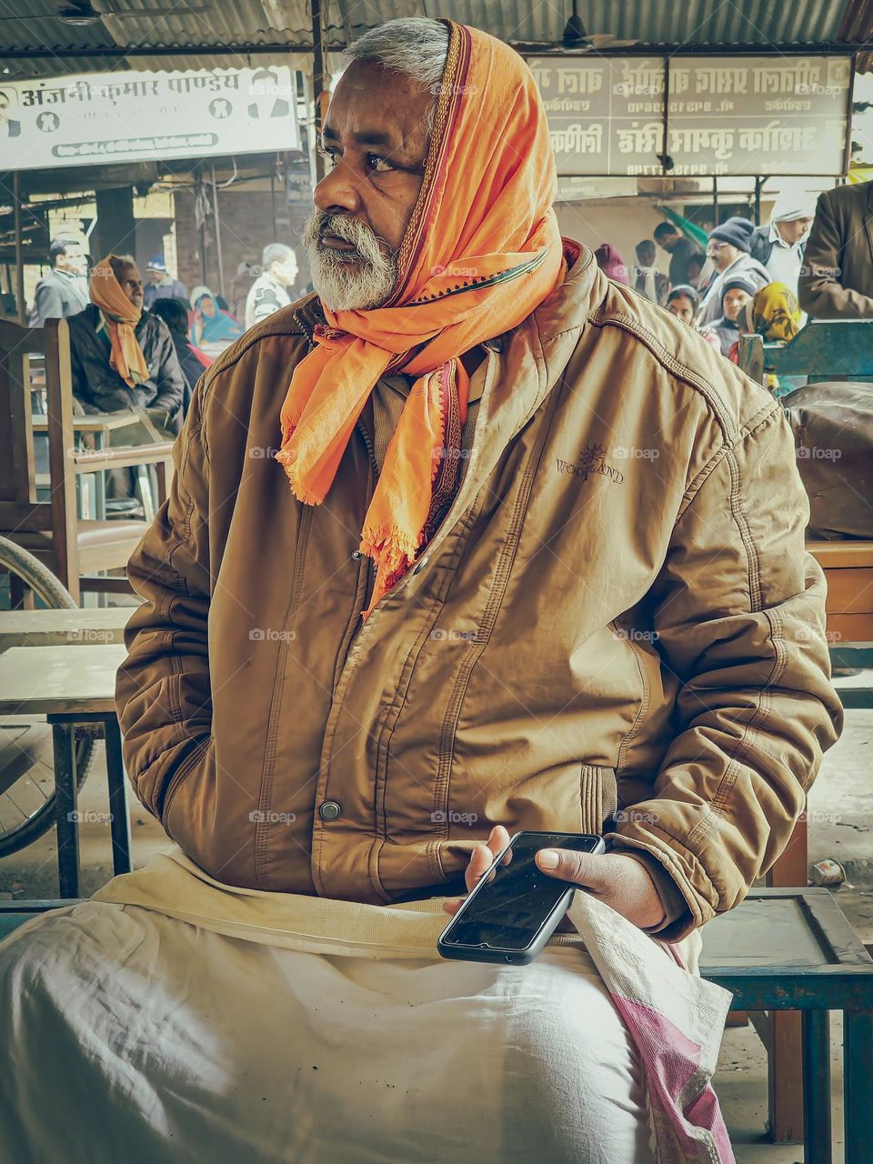 Indian old man wearing gamcha on his head and dhoti most famous cloth in india