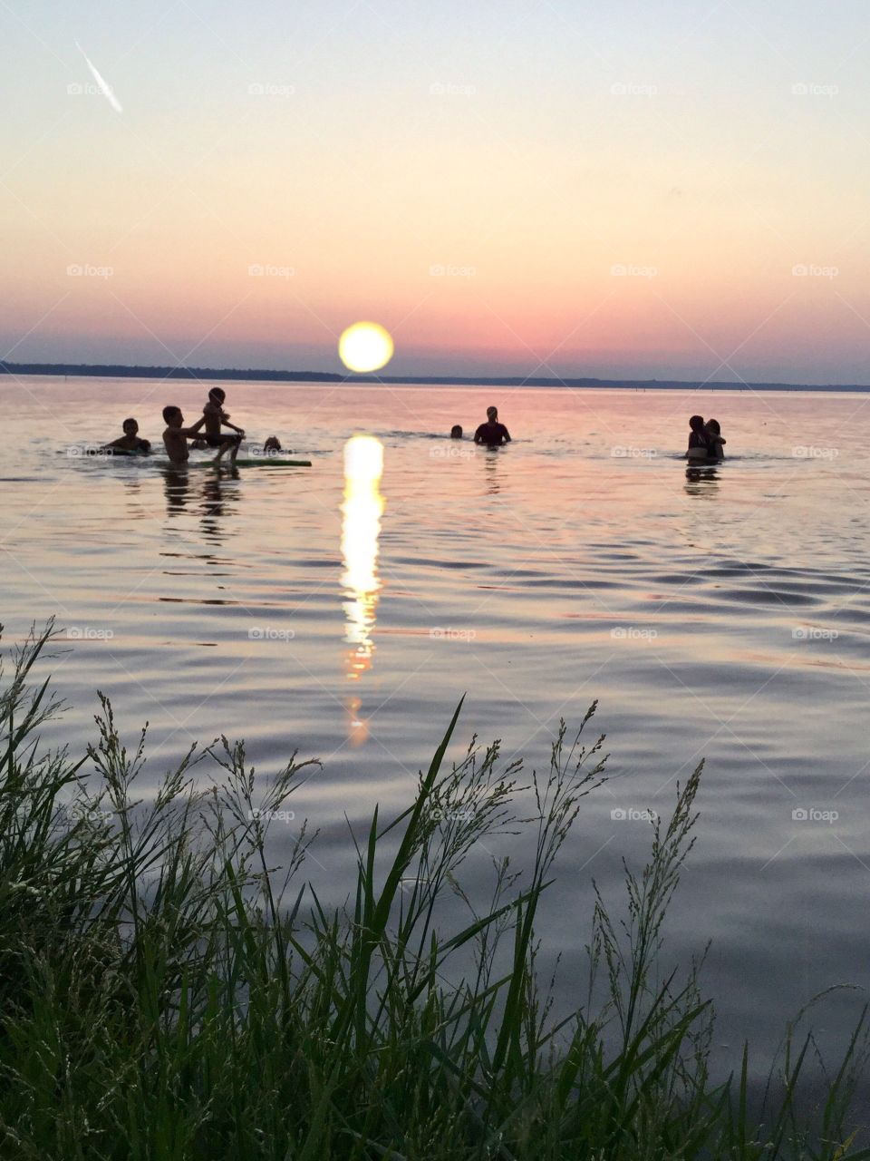 Local kids swimming after school.  Toledo  Bend Lake Converse, La.  August 2017 sunset