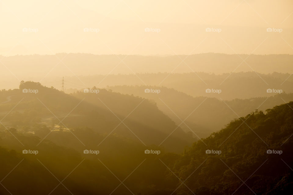 Scenic view of fog and mountains