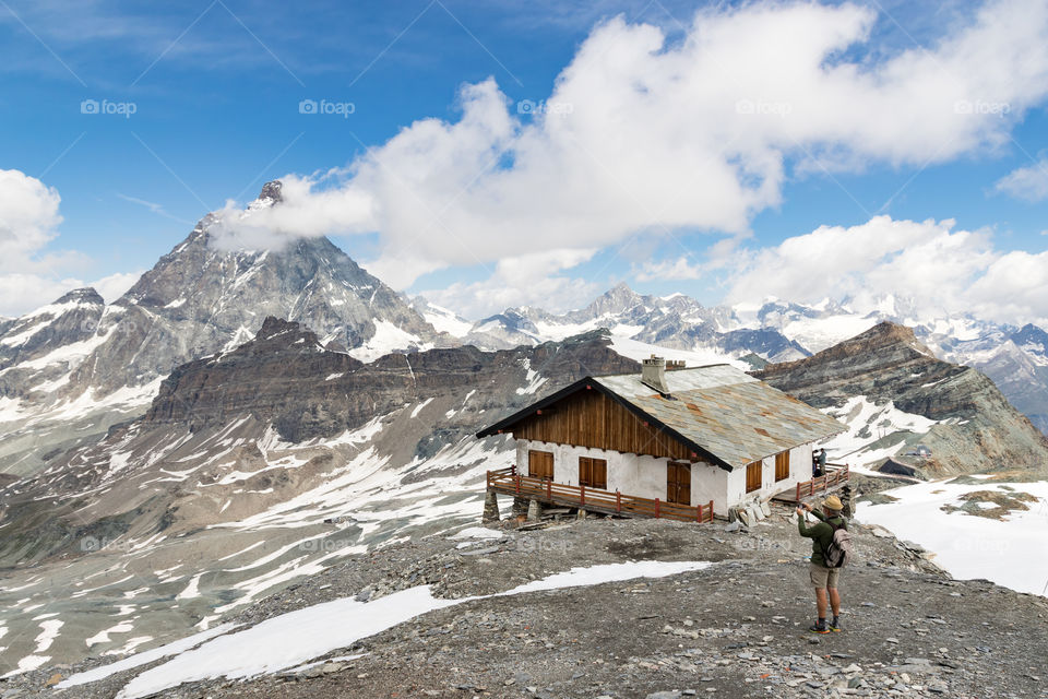 Hiking on high altitude in the the mountains on a beautiful day, view of Matterhorn 