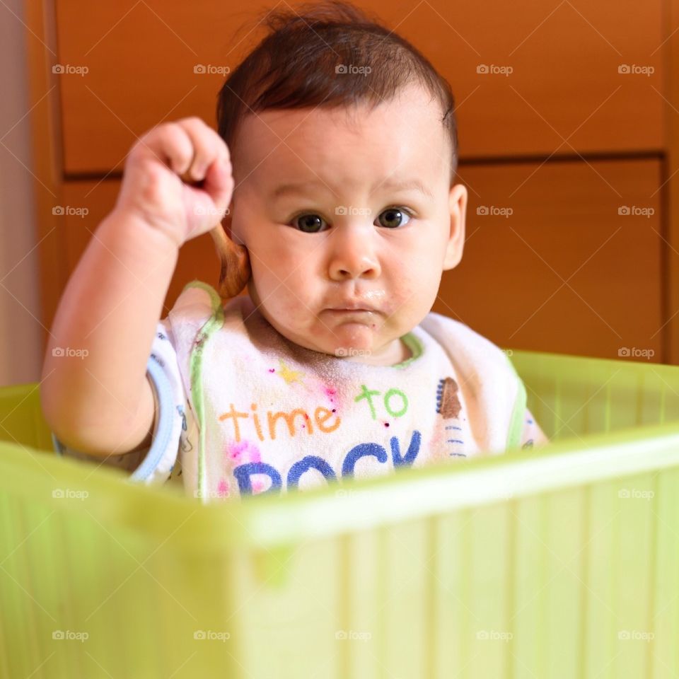 Beautiful baby girl in laundry box