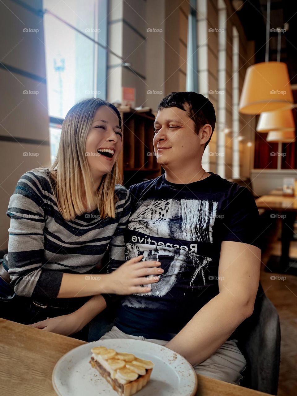 young couple in a cafe, bright emotions happiness