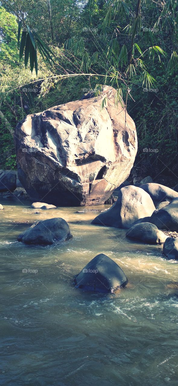 The big rock in the middle of the river