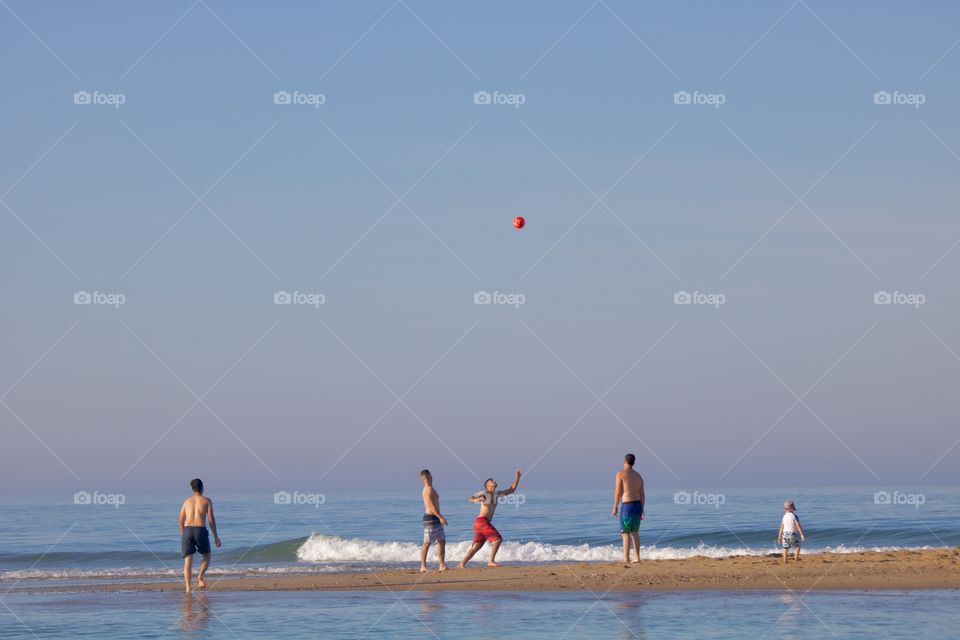 Playing soccer on the beach