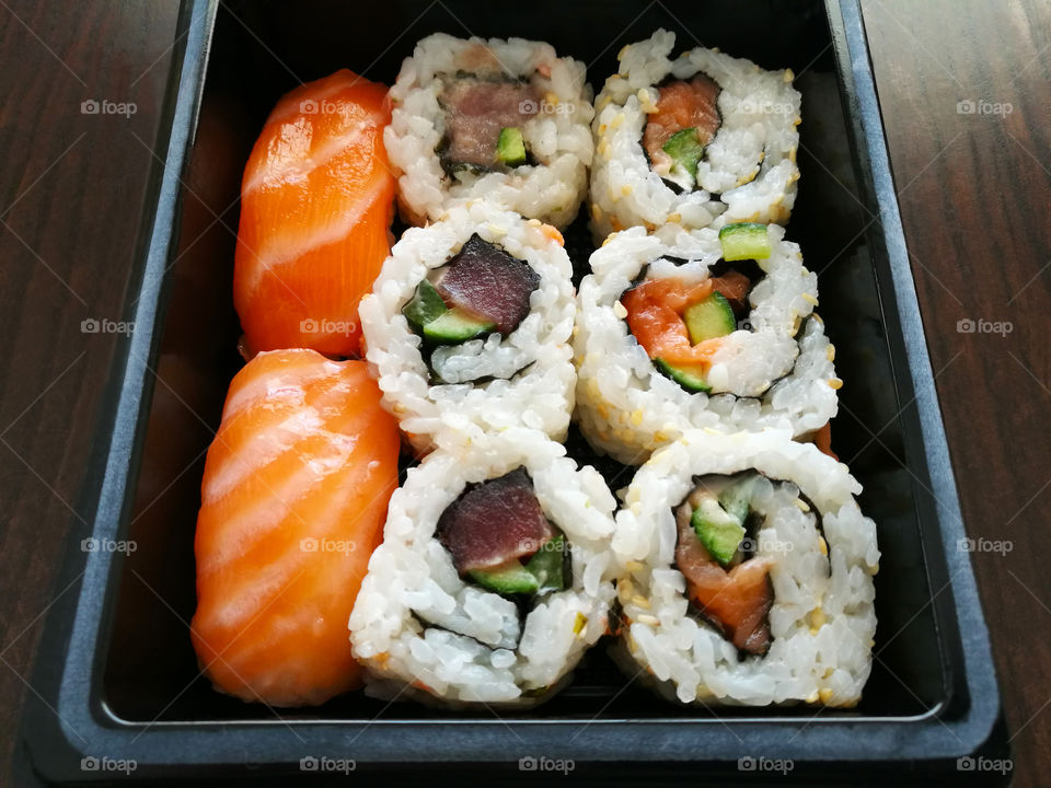 Sushi and Sashimi with tuna, salmon, cucumber and seaweed. Japanese food.