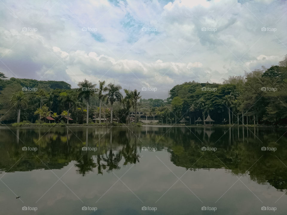 The surrounding landscape is beautiful. So quiet and green. The beauty reflected the nearby waters of the lake.