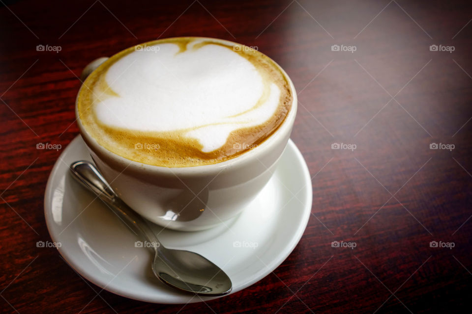 Close-up of coffee on wooden table